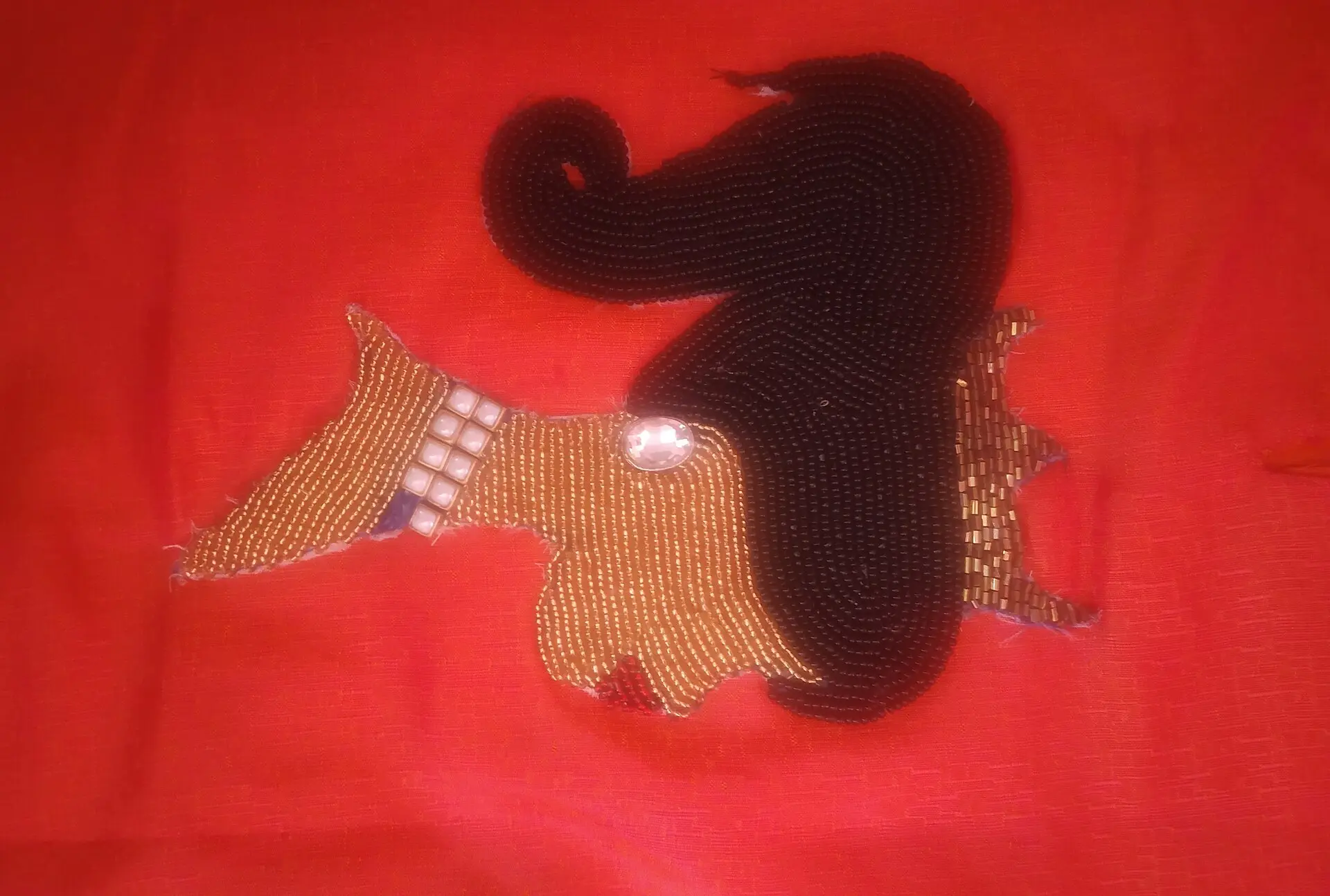 Detailed bead embroidery and hand finishing